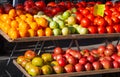 Display of fresh ripe tomatoes at a local farmer`s market Royalty Free Stock Photo