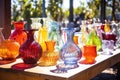 display of handblown glass art under sunlight