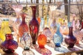 display of handblown glass art under sunlight