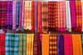 display of handmade woven scarves and shawls