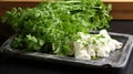 Display of just cut chive blossoms on marble