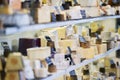 Display Of Local Cheeses In Chiller Cabinet Of Local Delicatessen Food Store Royalty Free Stock Photo