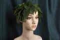 a display mannequin wearing hair of leaves