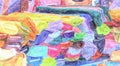 Display on a market stall with many colourful fabric bales