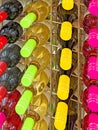 display rack of California wine bottles with caps of variety of colors