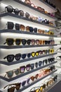 Display rack full of sunglasses. Fashionable sunglasses on the shop shelf Royalty Free Stock Photo