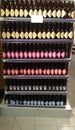 Display shelf of many Dutch craft beer bottles with colorful labels lined up