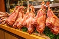 display of smoked turkey legs in a market