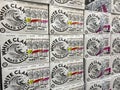 A display of stacked cases of White Claw at a Walmart Superstore