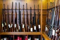 Display stand with hunting and sporting rifles in gun shop Royalty Free Stock Photo