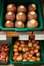 Display Of Swedes And Onions In Organic Farm Shop