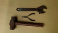 Display from top of old adjustable wrench, old hammer, small metal cutting tools Royalty Free Stock Photo