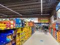 A display of a variety of potato chips and cookies at an Aldi grocery store