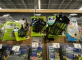 A display of various brands of pet muzzles and leashes for sale at a Petsmart Superstore