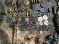 display of various coins, pendents and decorative pieces on a table