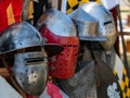 display of various types of medieval plate armor helmets