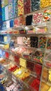 Display wall of Haribo candies of various flavors for sale by weight. Bonn-based German confectionery company