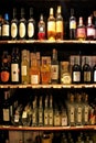 Display of wine and grappa in a shop inside Montalcino Fortress, Royalty Free Stock Photo