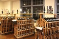 Tasting room with racks of bottled wines, Belhurst Castle, Geneva and Winery, New York, 2018