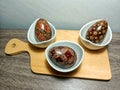 display of wooden craft eggs on the table with Indonesian batik motifs