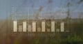 Displaying bar chart and line graph overlaying grassy field, with labels, grid lines and waveforms Royalty Free Stock Photo