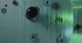 Displaying digital network overlay hovering in server room, with glossy spheres and green LEDs Royalty Free Stock Photo