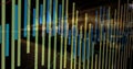 Displaying financial chart featuring bars over blurred city lights, with red and teal trend lines Royalty Free Stock Photo