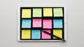 Displaying a grid of sticky notes in various colors yellow green blue and Royalty Free Stock Photo