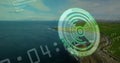Displaying HUD hovering over coastal headland, with green reticle and code lines, copy space Royalty Free Stock Photo