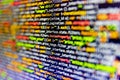 Displaying program code on computer. Blurred screen with selective focus. Web server data on a monitor. Code on dark background. Royalty Free Stock Photo