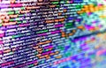 Displaying program code on computer. Javascript code in bracket software. Futuristic colorful piece of program code on black Royalty Free Stock Photo