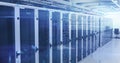 Displaying server cabinets aligned on shiny floor in data center room, with overhead cable trays Royalty Free Stock Photo