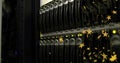 Displaying server rack drive bays in data center, with glowing LEDs and golden star overlays Royalty Free Stock Photo