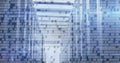 Displaying server racks streaming binary code overlay in data center corridor, with network cables Royalty Free Stock Photo
