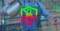 Displaying shield icon shifting from green to red in office code, with padlock and fingerprint Royalty Free Stock Photo