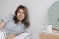 Displease and unhappy woman has to wake up in the morning. Royalty Free Stock Photo