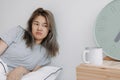 Displease and unhappy woman has to wake up in the morning. Royalty Free Stock Photo