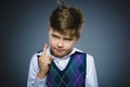 Displeased angry boy with threatens finger isolated on gray background Royalty Free Stock Photo