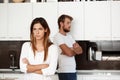 Displeased beautiful brunette girl in quarrel with her boyfriend background.