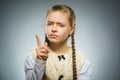 Displeased and contemptuous girl with threatens finger on gray background Royalty Free Stock Photo