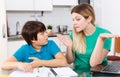 Displeased family doing homework Royalty Free Stock Photo