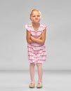 Displeased little girl with crossed arms pouting Royalty Free Stock Photo