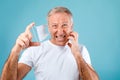 Displeased Mature Man Scratching Skin After Wearing Protective Medical Mask