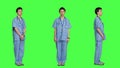 Displeased nurse saying no and sighing against greenscreen backdrop