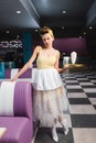 displeased pin up waitress holding tray Royalty Free Stock Photo