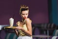 displeased pin up waitress with tattoo Royalty Free Stock Photo