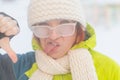 Displeased woman freezes in the cold outside. Royalty Free Stock Photo