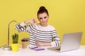 Displeased woman office worker showing thumbs down, dislike gesture, expressing disapproval. Royalty Free Stock Photo