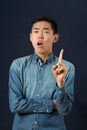 Displeased young Asian man gesturing with one hand Royalty Free Stock Photo