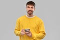 Displeased young man with coffee cup Royalty Free Stock Photo